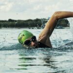 Person Swimming on Body of Water