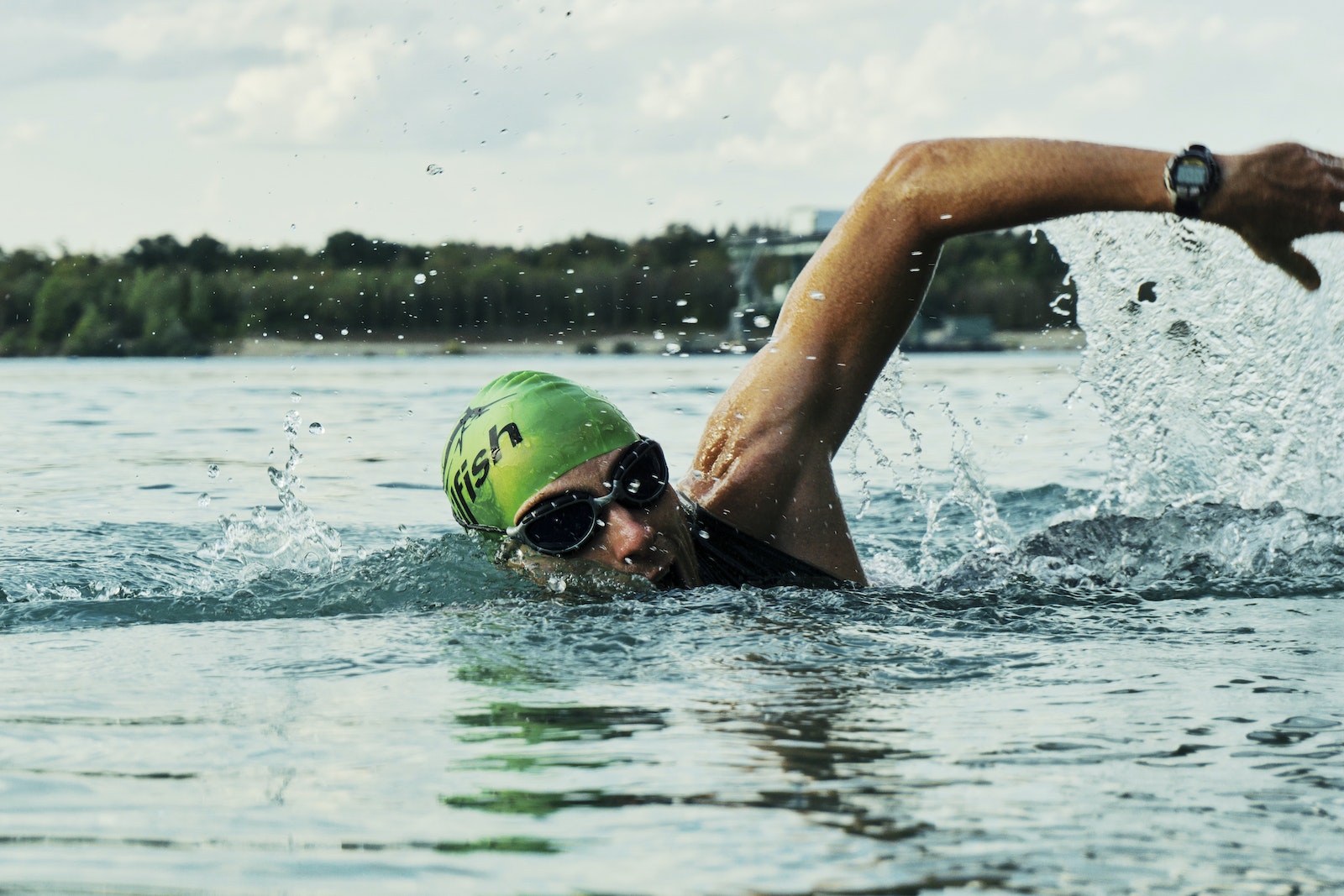 Person Swimming on Body of Water