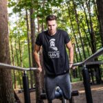 Man In Black T-shirt Doing Exercise