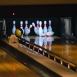 bowling balls hitting pins