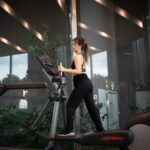 a woman is running on a treadmill